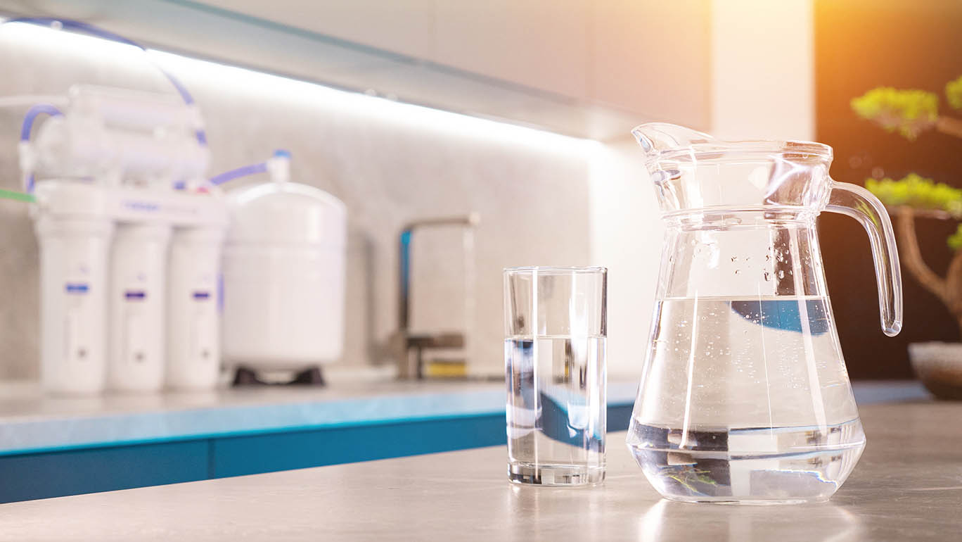 water filtration system and glass of clean water